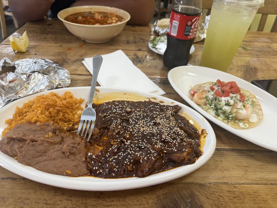Casual dining tables inside a Mexican restaurant.